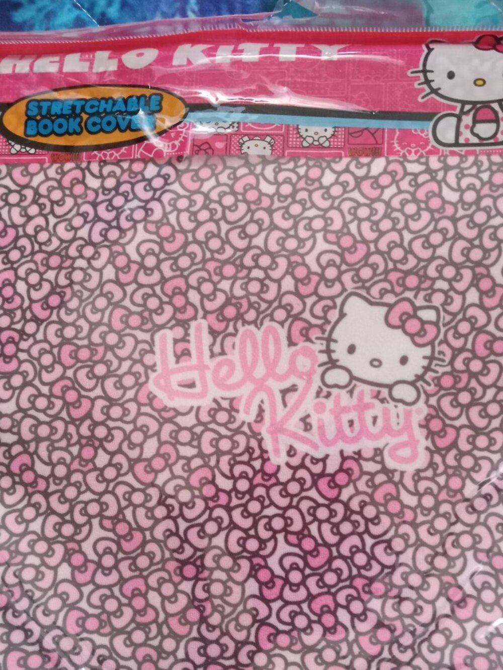$7 or FREE w/$15+ 2013 Hello Kitty Stretchable Book Cover up to 8.5"x11"